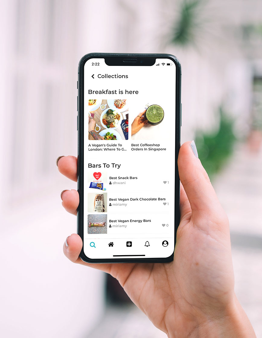 Person Holding Phone A diverse group of people collaborating around a table, each using laptops for a productive discussion