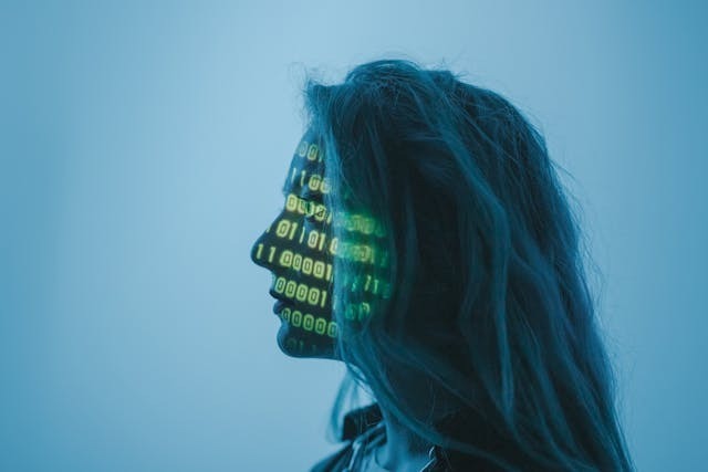Customer Support Chatbots A woman with glowing green eyes stands against a vibrant blue background, creating a striking and mysterious atmosphere.