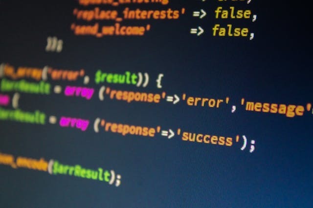 A computer screen displaying a dense array of colorful code snippets and programming syntax.